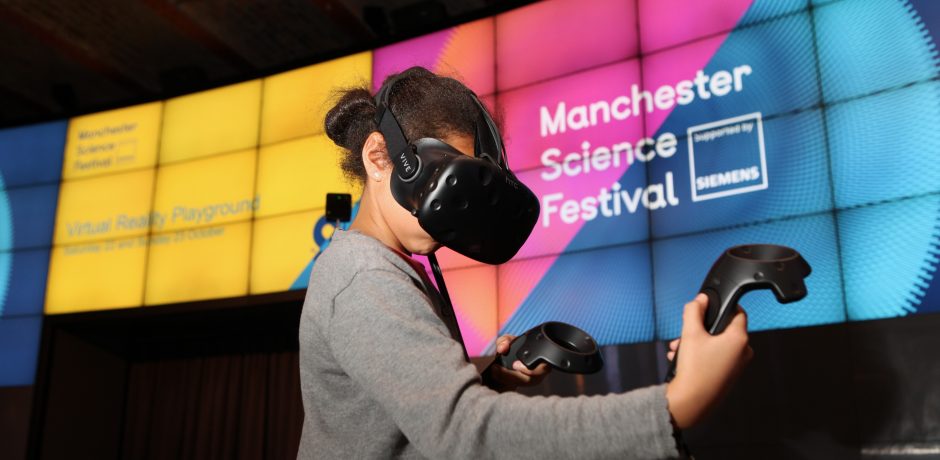 Picture of girl using VR headset at the Manchester Science Festival